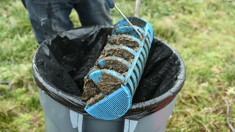 Man holding a Tuf - filter of septic system tank and water wells. Inspectio.. Stock Footage 238563574