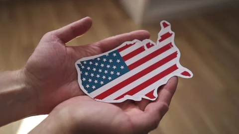 Man holding US map with flag pattern, concept of american electoral college and 動画素材 343956550