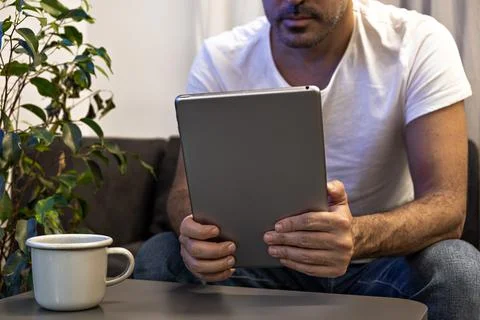 Man holding using digital tablet at home. Online education, working, video call Stock Photos