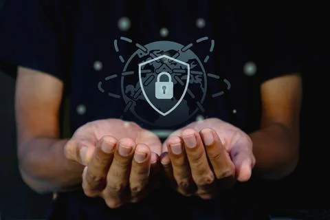 A man holding virtual shield protect icon. Information and cyber security o.. Stock Photos