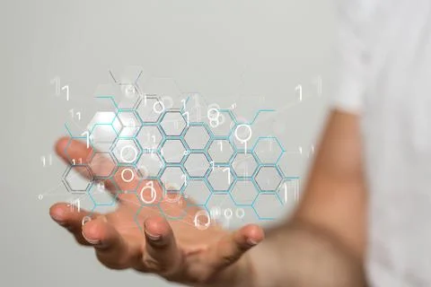 Man holding the virtual tech transparent hexagonal grid in his hand. Coding conc Stock Photos