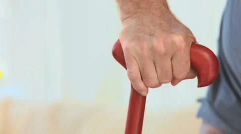 A man holding a walking stick Stock-Footage 2103789