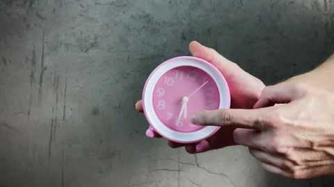 A man holding a watch with hands at half past five, the concept of sexual Video stock 296689765