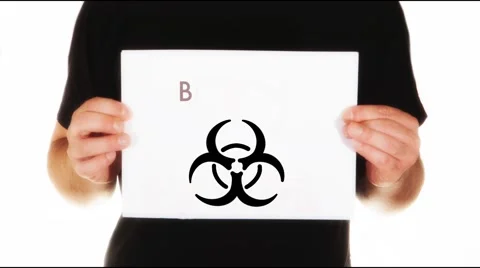 Man holding white message board with text biohazard and animated Stock Footage 45859100