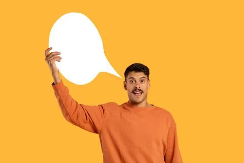 Man Holding White Speech Bubble Above His Head Stock Photos