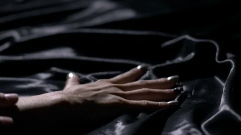 Man holding a woman's hand down in bed in sexual game Stock Footage 104465059