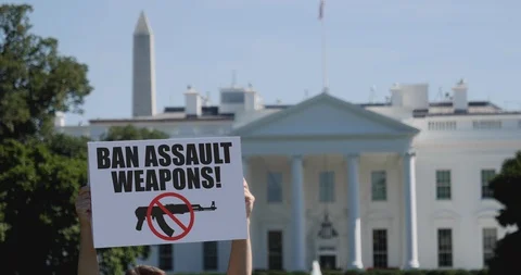 Man Holds Ban Assault Weapons Sign in Front of White House Stock Footage