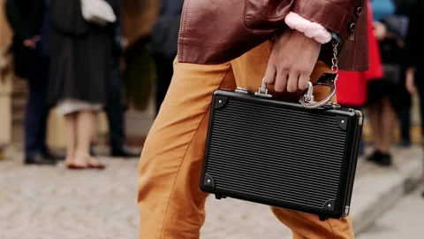 A man holds a black briefcase handcuffed to his hand, close-up Stock Footage 324842389