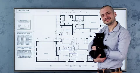 A man holds a black cat Stockbeeldmateriaal 234929192