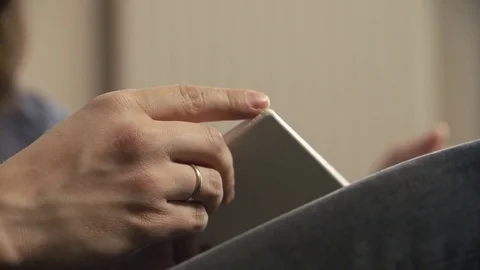 Man holds a book on his knees Stock Footage