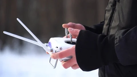 Man holds a control panel for a drone Stock Footage 85994589