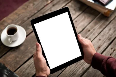 Man holds digital tablet computer in his hands 写真素材