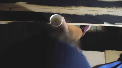 A man holds a disposable cup in his hand and then drinks from it. view from a Stock Footage 103300145