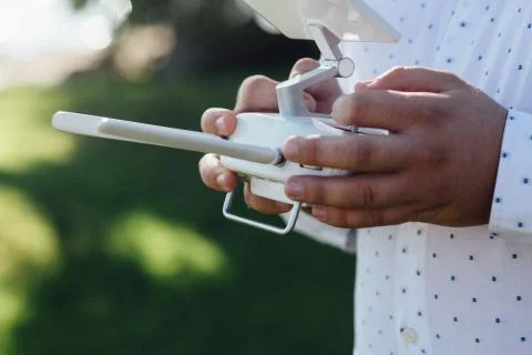 Man holds a drone remote controller in his hands. Close-up of quad copter RC Stock Photos