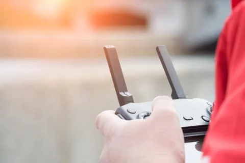 Man holds a drone remote controller in his hands Foto stock