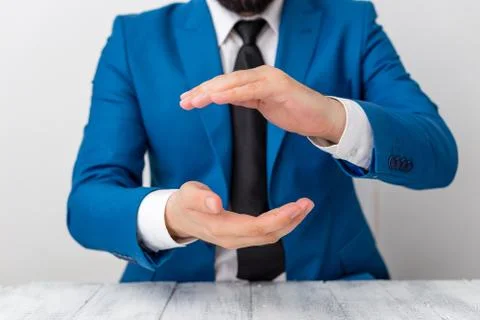 Man holds empty paper with copy space in front of him. Business concept with man Stock Photos