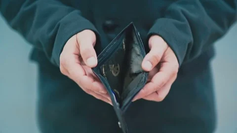 Man holds an empty wallet in his hand Stock Footage