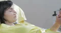 man holds the hand of his wife in the hospital HD Footage
