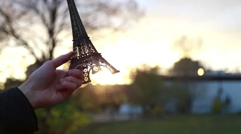 Man holds in his hand the Eiffel Tower Stock Footage 56377671