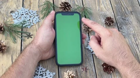 A man holds in his hand a mobile phone Stock Footage 213064355