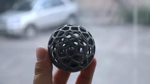 Man holds in his hand model that printed on 3D printer. Stock Footage 160346561