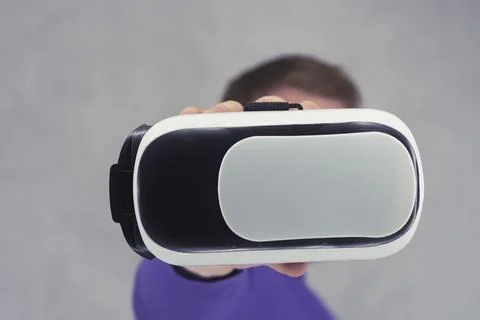 Man holds in his hands glasses for virtual reality and 360-degree video. VR h Stock Photos