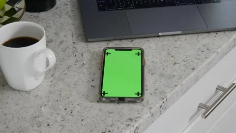 Man holds up iPhone green screen Stock Footage 157515867