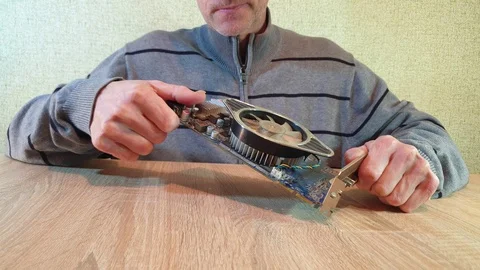 A man holds the item from the computer. Video card for the computer. Stock Footage 101737068