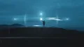 The man holds a magic light ball on the mountain top 4k or 4k+ Resolution
