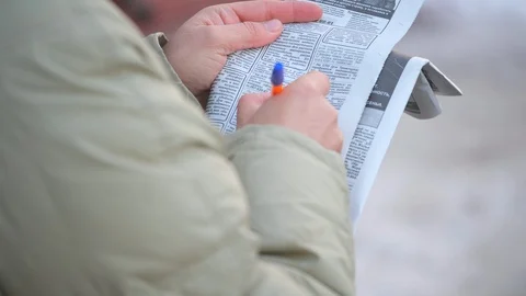 A man holds a newspaper  Stock Footage 116771393