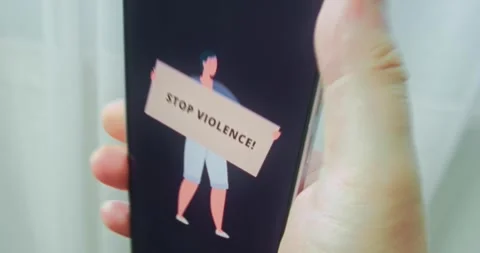 Man holds a poster with words Stop Violence, presentation Stock Footage 313506522