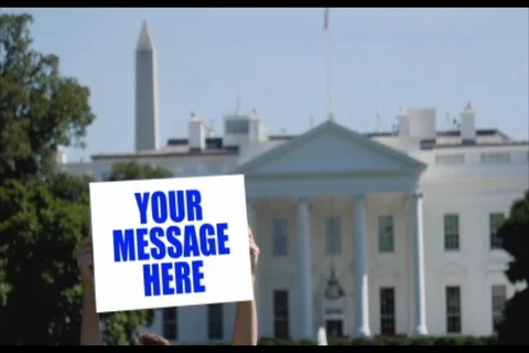 Man Holds Pre-Tracked Protest Sign Outside White House  After Effects	Stock