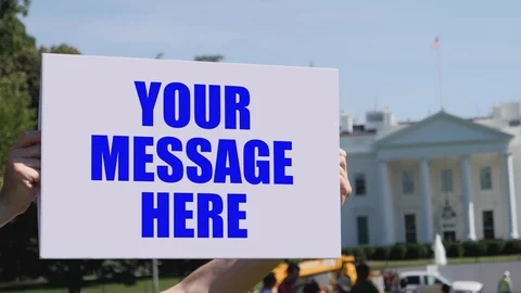 Man Holds Pre-Tracked Protest Sign Outside White House  After Effects	Stock