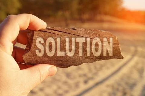 A man holds a sign in his hands - SOLUTION Stock Photos