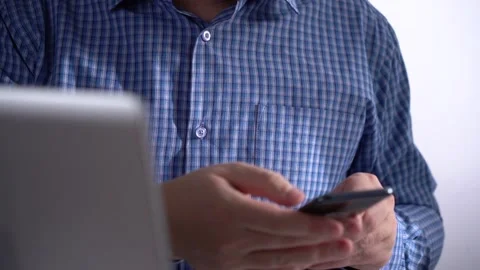 Man Holds Smartphone. Part of the Notebook in the Clip Frame Stock Footage 151462632