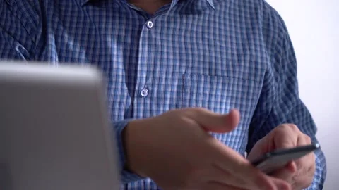 Man Holds Smartphone. Part of the Notebook in the Clip Frame Stock Footage 151857662