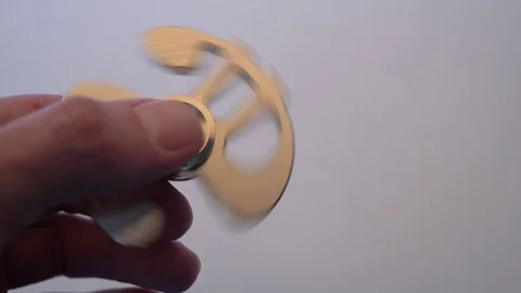 A man holds a spinning spinner in his hand. 4k Stock Footage 84310001