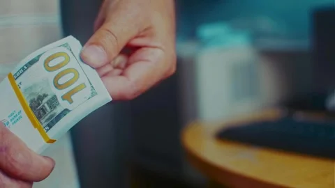 A man holds a stack of banknotes in his hands Stock Footage 310009921