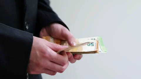 Man holds stack of euro banknotes as concept of financial stability and income. Stock Footage 336624511