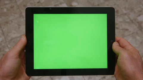 MAN HOLDS TABLET COMPUTER WITH GREEN SCREEN 4K Stock Footage 45203065