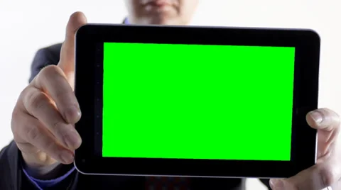 Man holds tablet PC to camera with green screen Stock Footage 36152634