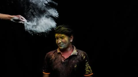 Man with holi colors Stock Photos