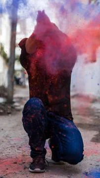 Man in holi colors Stock Photos
