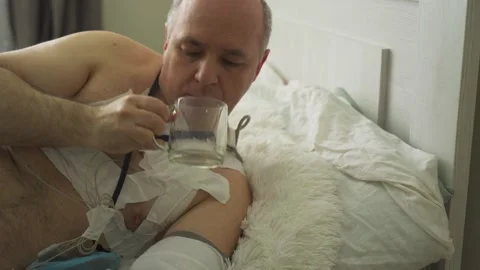 A man with a holter installed reveals malfunctions in the cardiovascular system Stock Footage 249463160