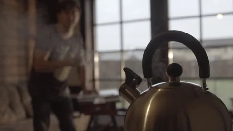 Man at home boiling kettle in slow motion Stock Footage 72283655