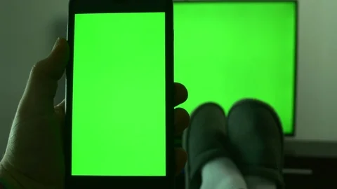 Man At Home Checking His Smart Phone While Watching TV, Green Screen, POV Vídeos de archivo 84166718