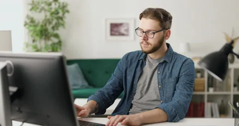 Man at home coding on pc Stock Footage 189030534