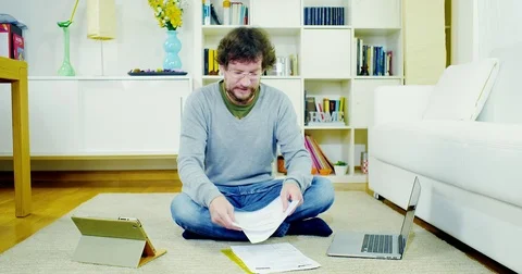 Man at home getting stressed out with bills and taxes Stock Footage 70862197