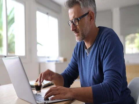 Man at home having a headache in front of laptop Stock Footage 81761426