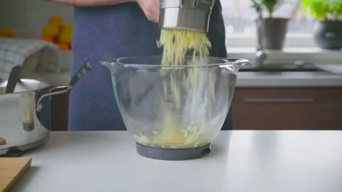 A man at home makes mashed potatoes Stock Footage 221469627